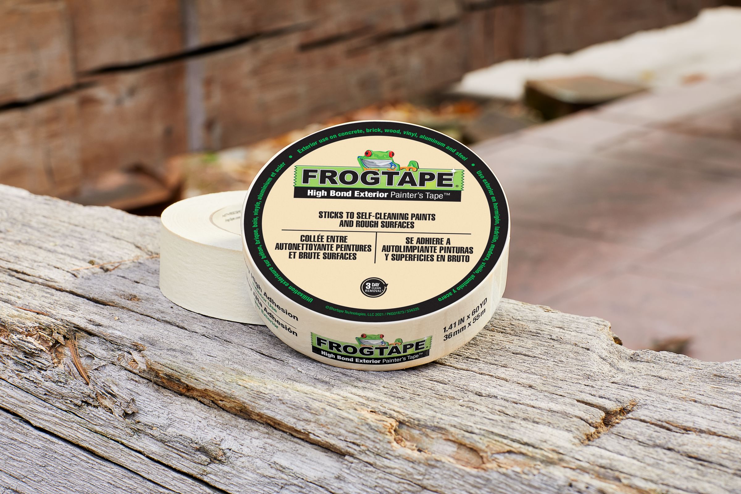 Two rolls of Beige FrogTape on a Wood table