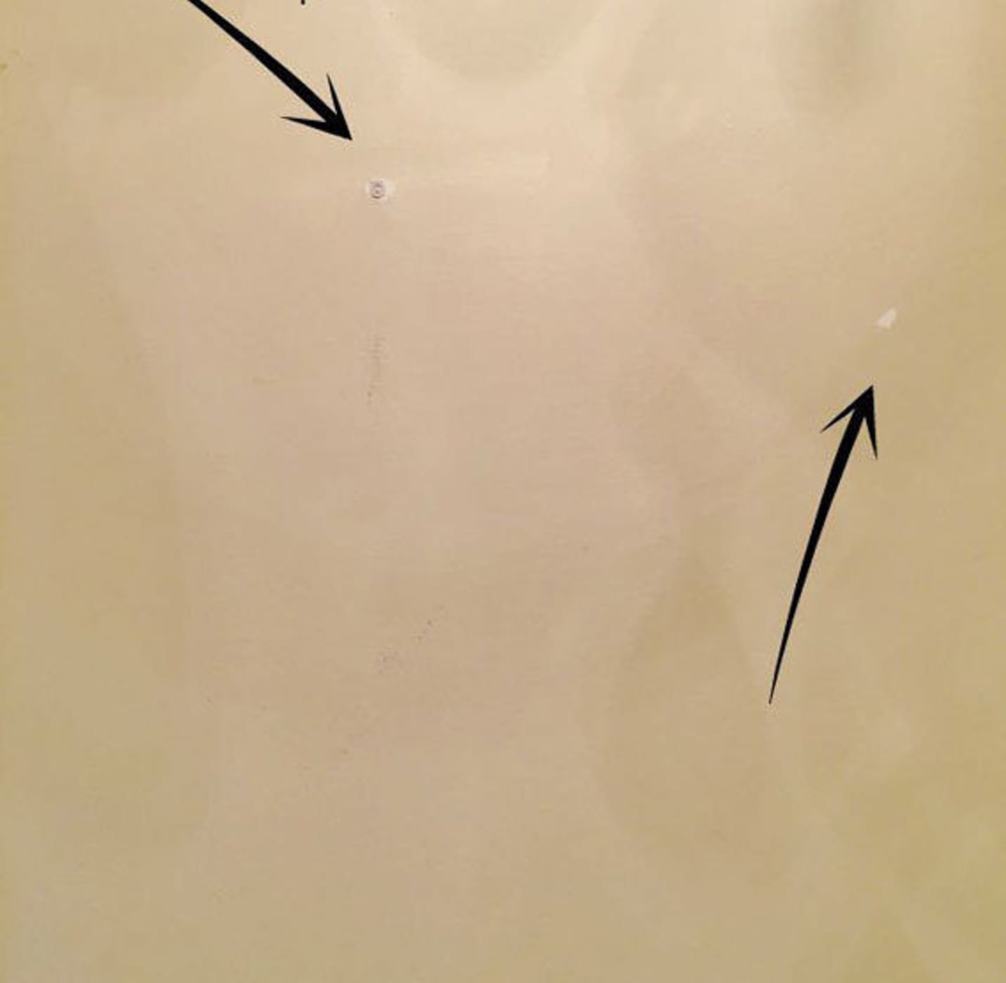 Patch Holes, arrows pointing to two holes in drywall