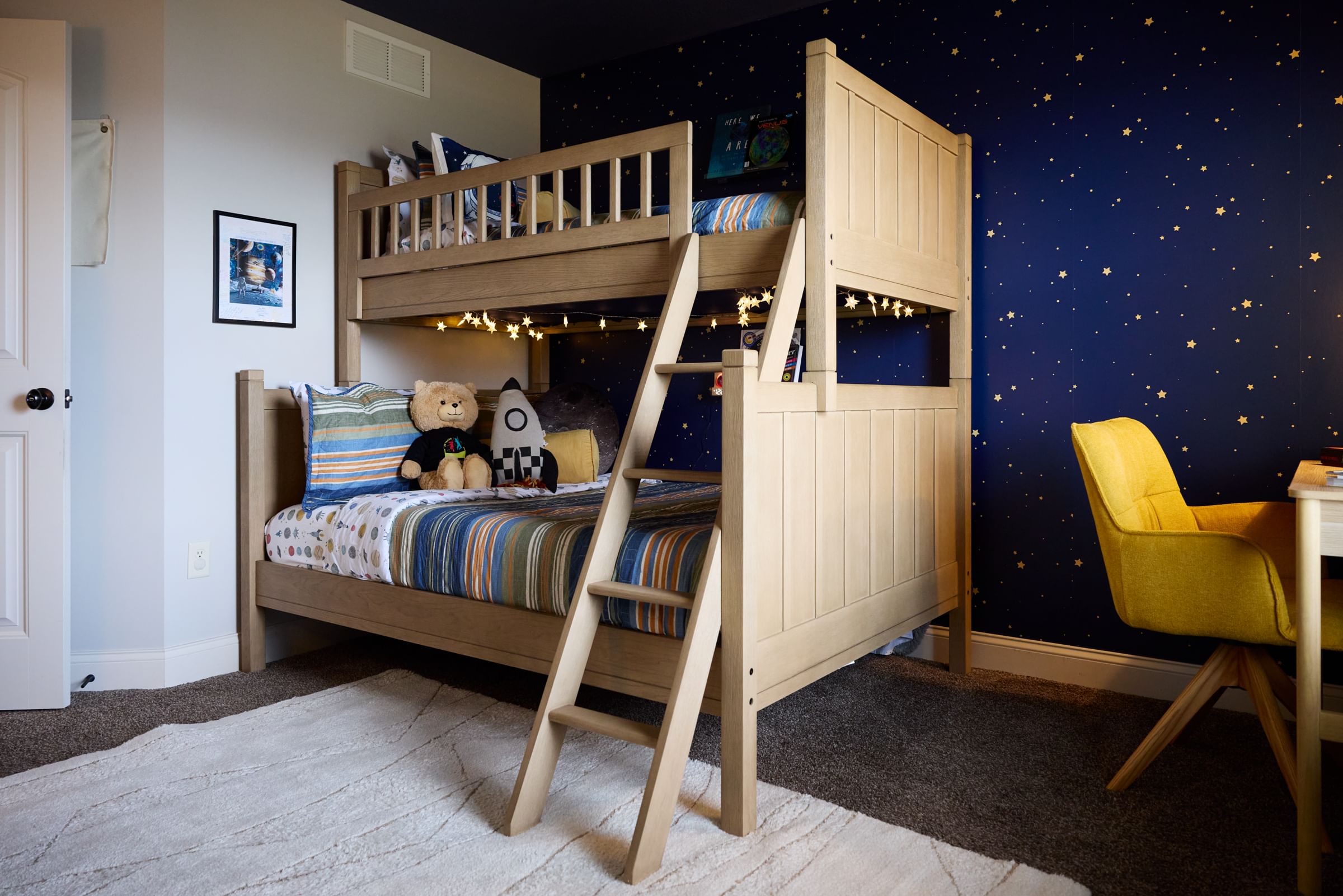 An outer space themed bedroom with Bunk bed