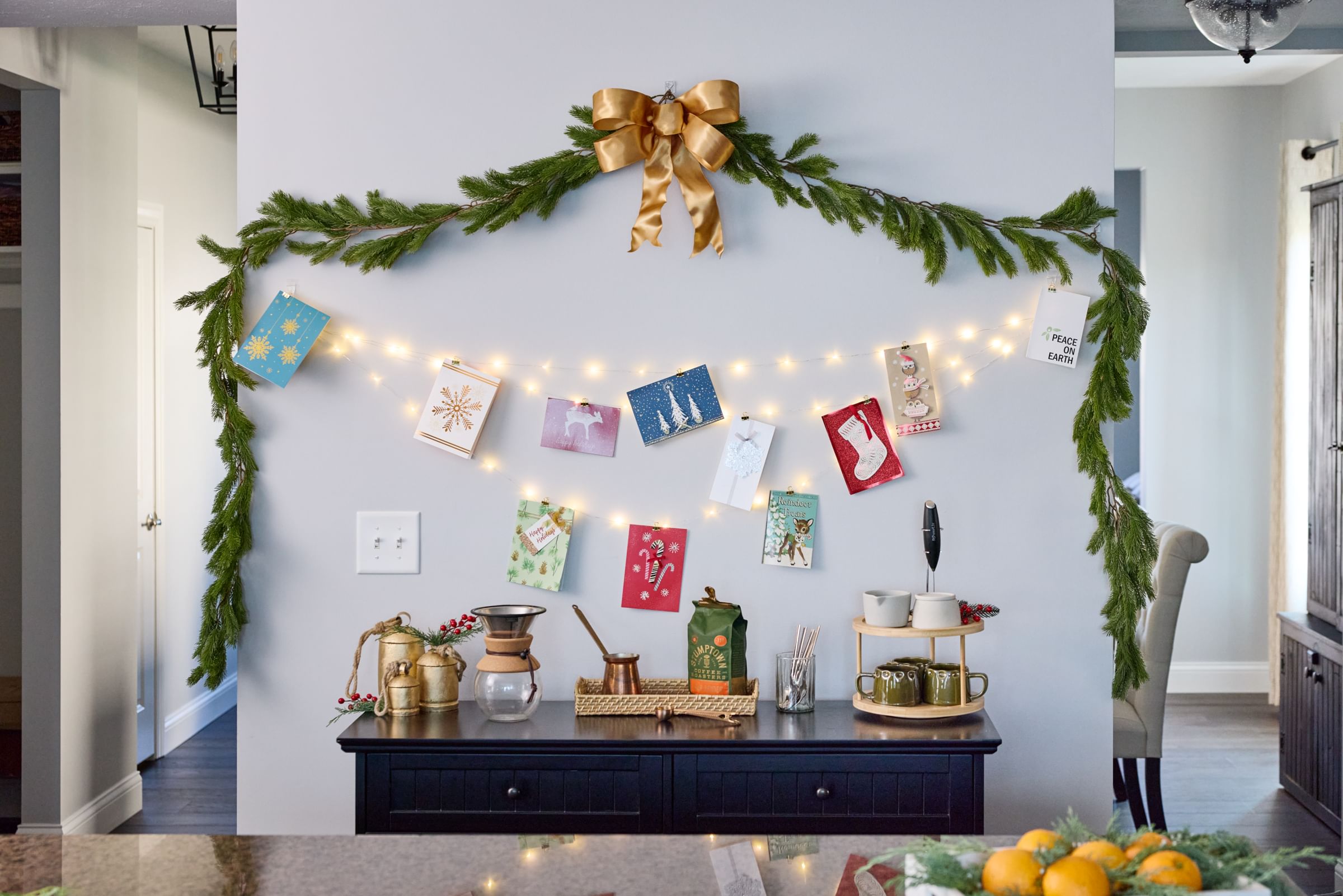 Holiday cards displayed on a wall using FrogTape reMOVEables hooks