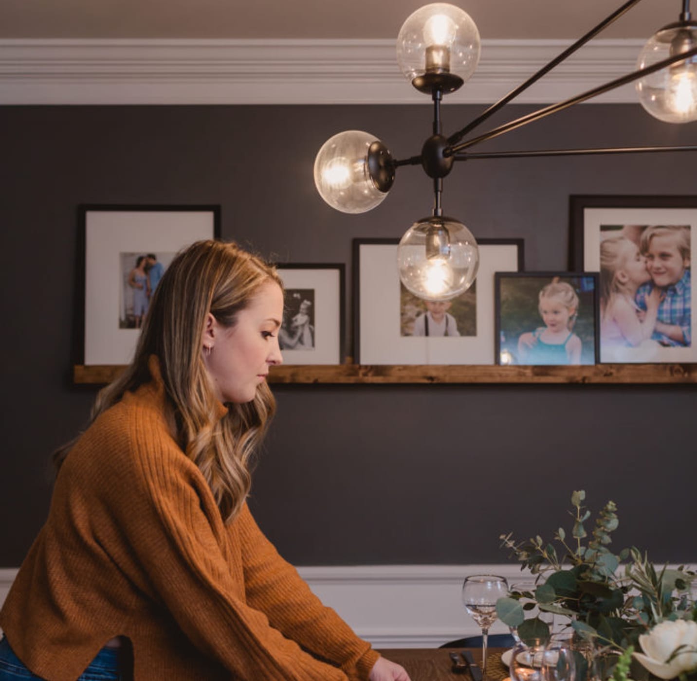 Woman setting a table for dinner