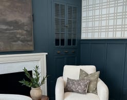 An office space with blue cabinets and wainscotting