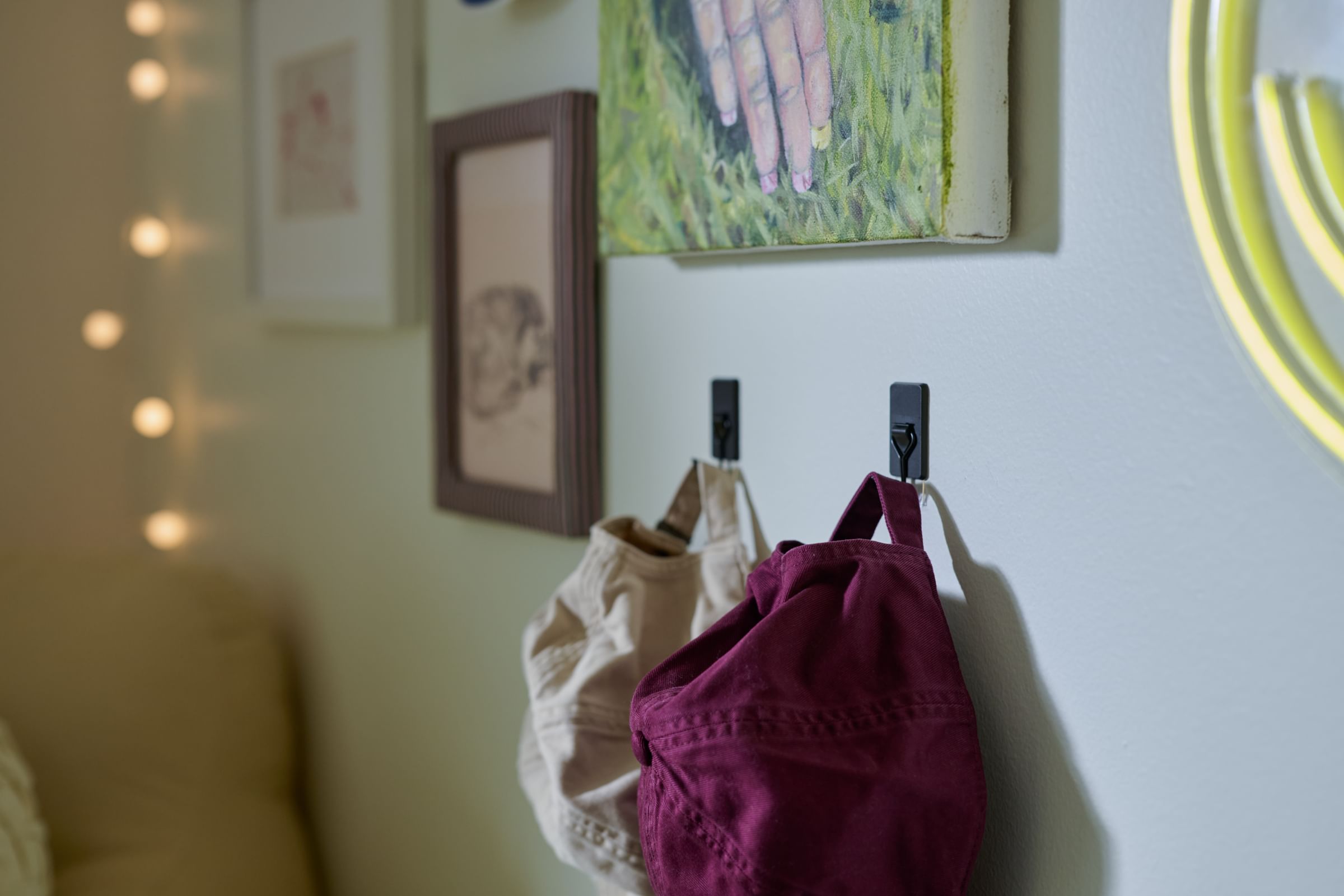 Hanging hats in a small apartment using FrogTape reMOVEables Wire Hooks