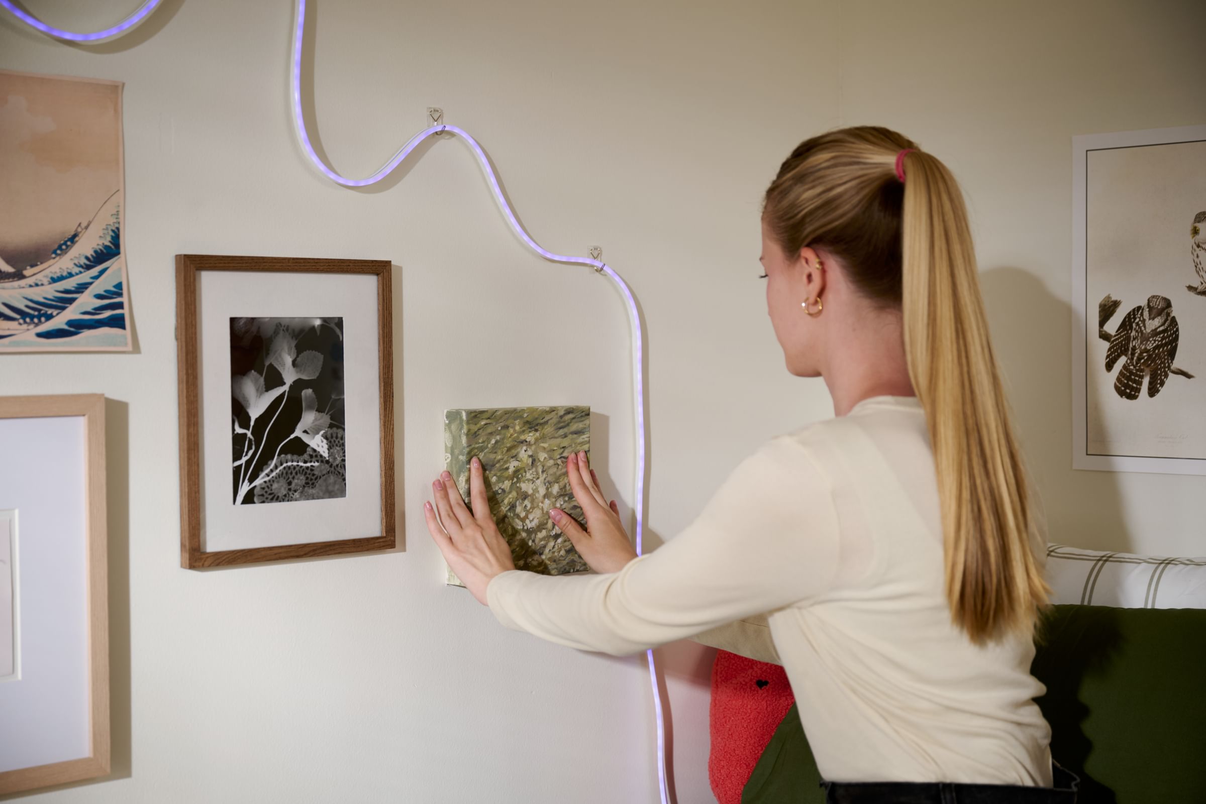 Wall décor in a dorm room using FrogTape reMOVEables Picture Hanging Strips and Poster Strips