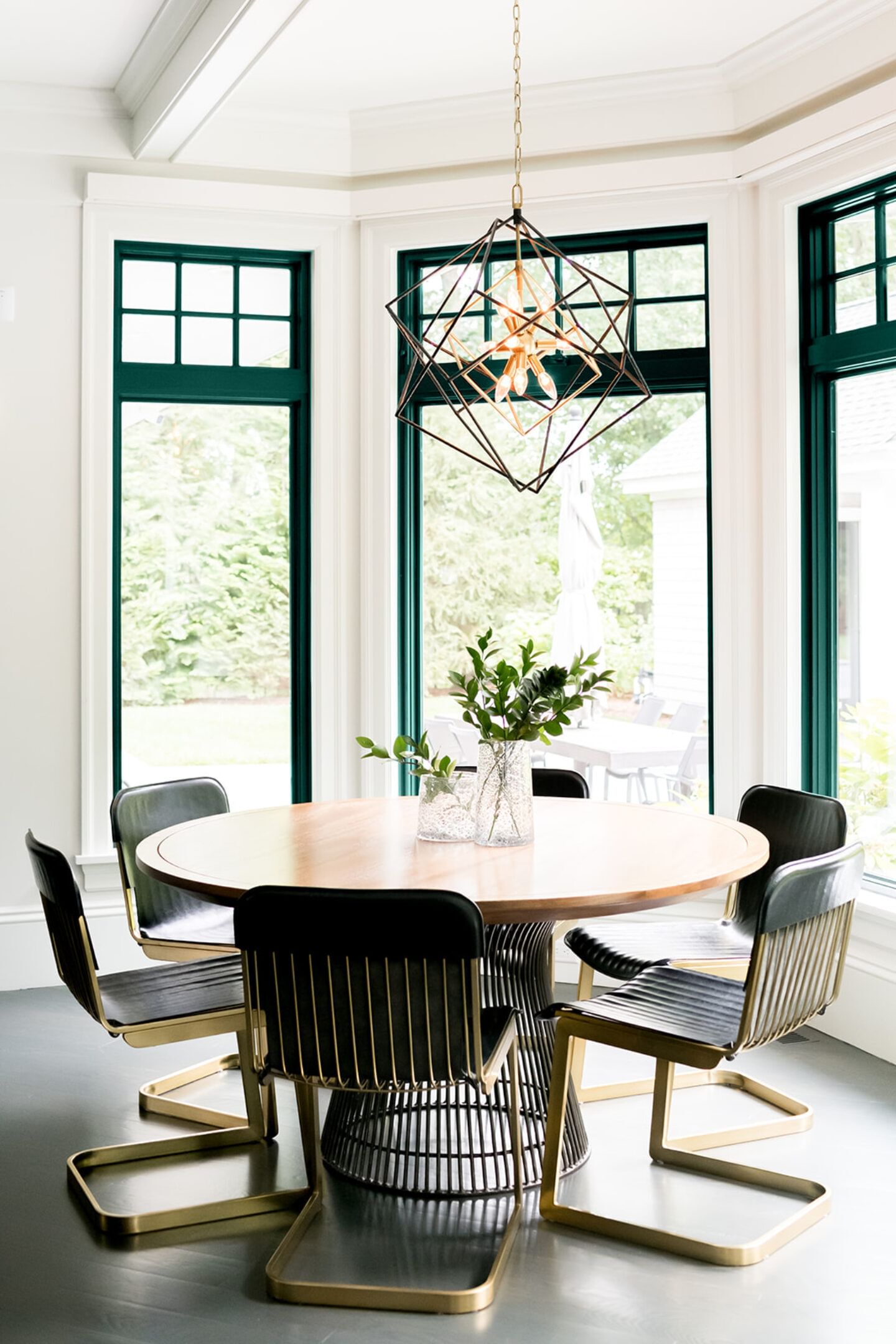 Dark green trim around windows in large eat-in kitchen