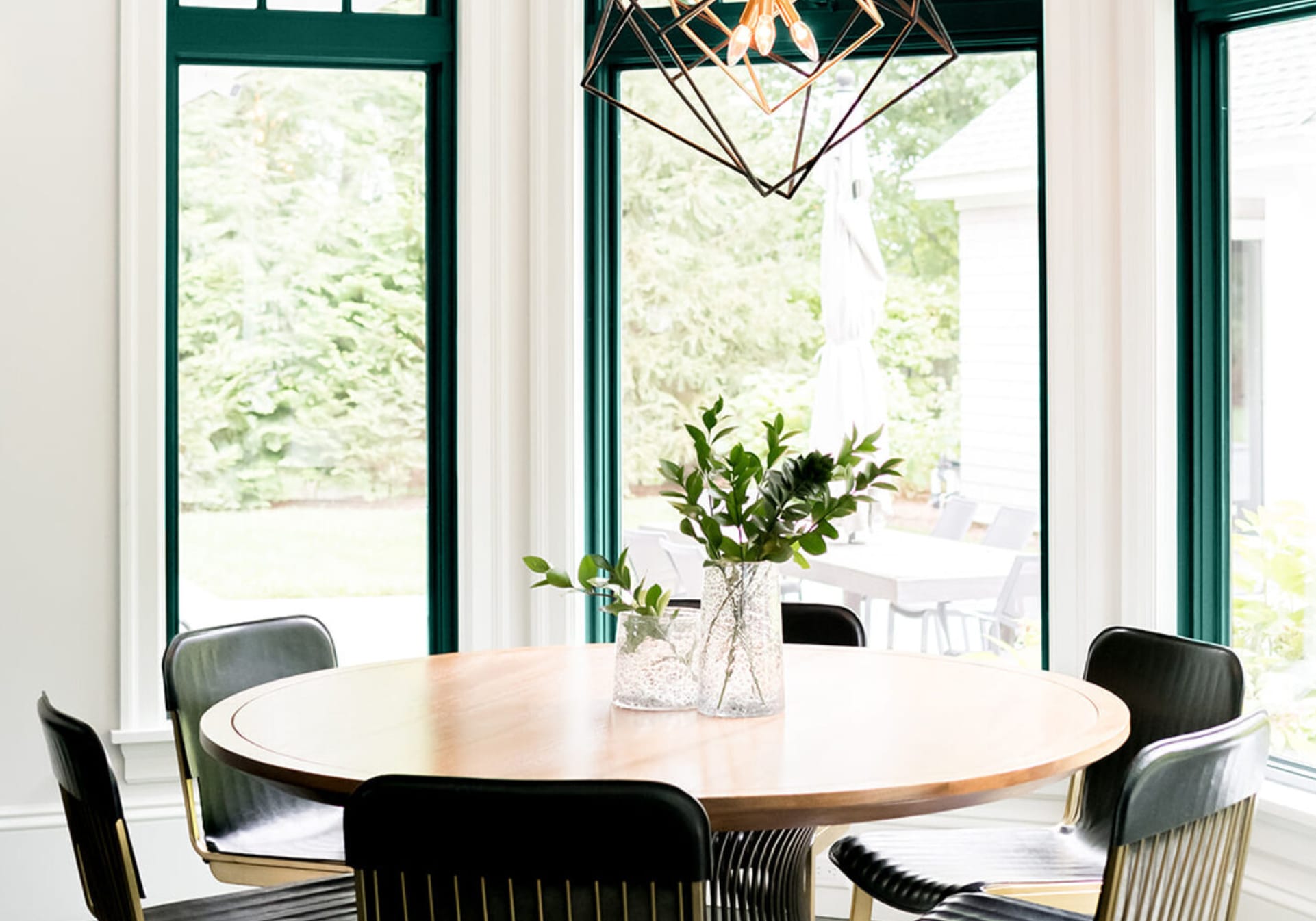 Dark green trim around windows in large eat-in kitchen