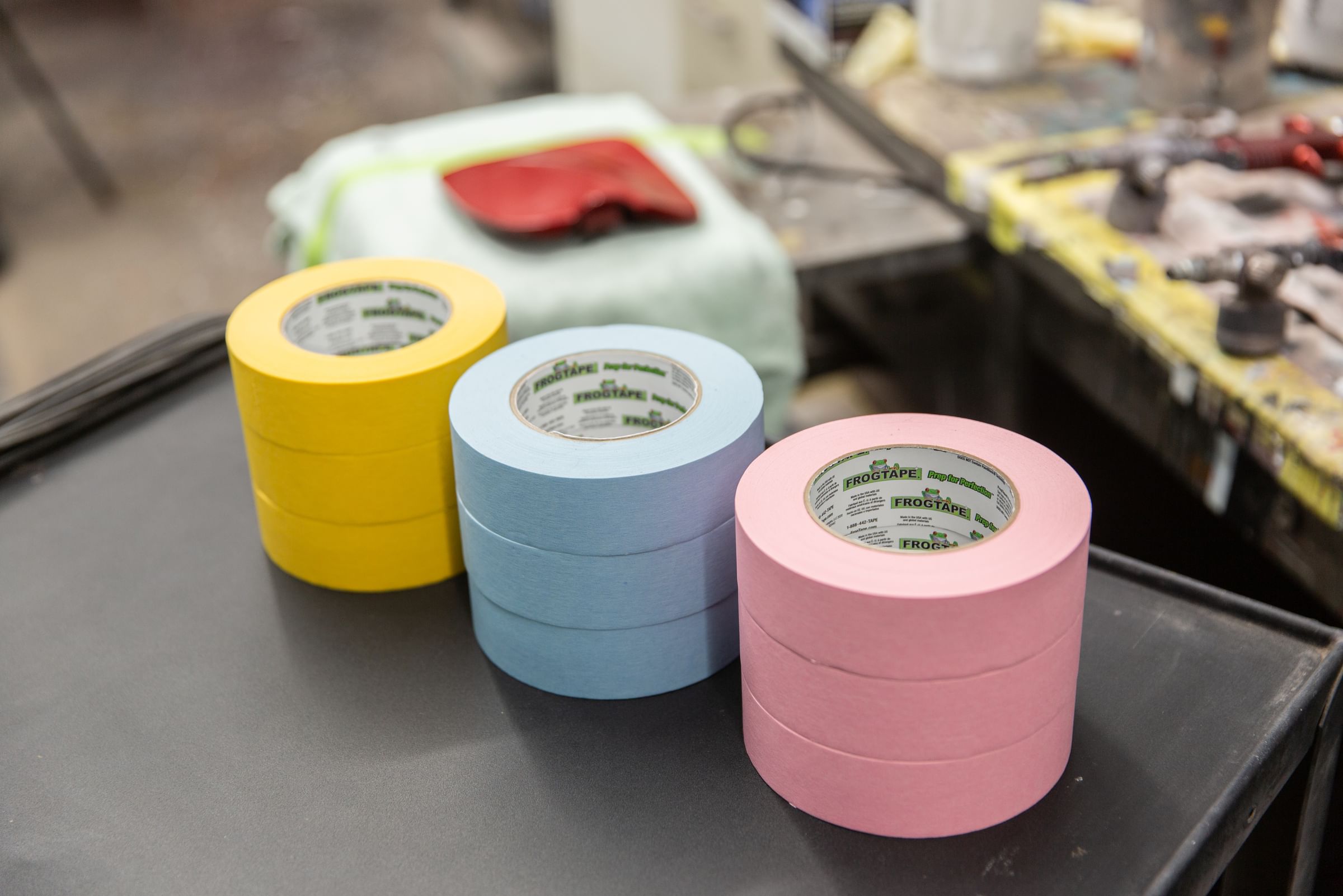 3 stacks of three rolls of FrogTape Performance Masking Tapes, Gold, Light Blue, Pink