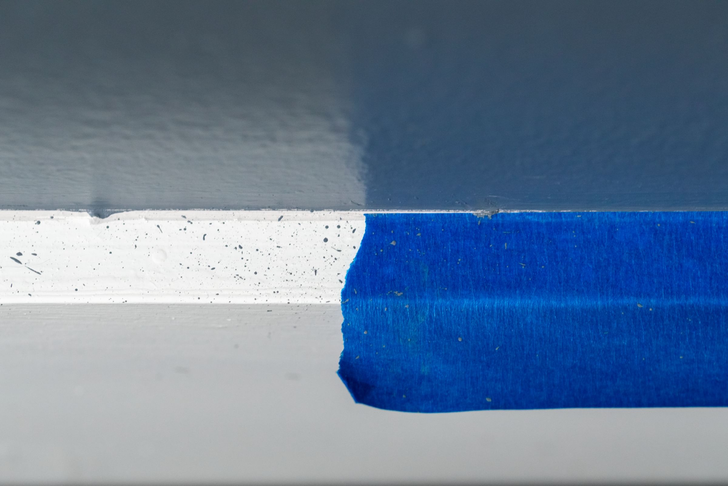 Blue FrogTape Pro Grade Painter's Tape taped horizontally on part of a wall