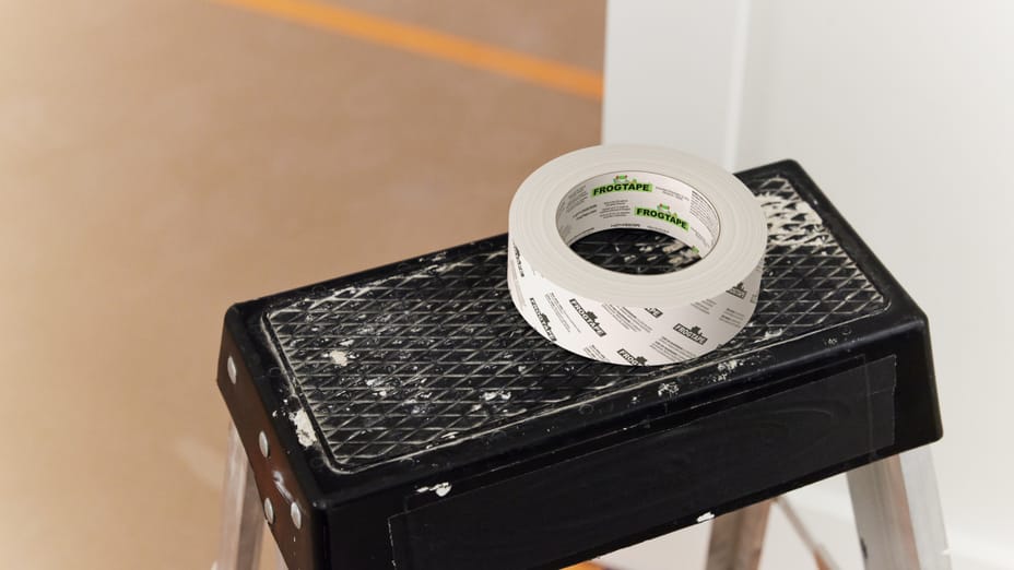 A white roll of FrogTape DS 154 sitting on top of a ladder