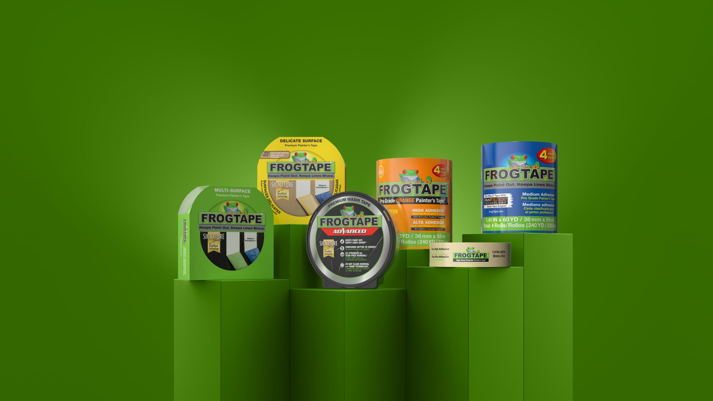 FrogTape Family of Products displayed with green background. Right to left: Green FrogTape Multi-Surface Painter's Tape, Yellow FrogTape Delicate Surface Painter's Tape, FrogTape Advanced Painter's Tape,  FrogTape Pro Grade Orange Painter's Tape, Beige FrogTape High Bond Exterior Painter's Tape, and Blue FrogTape Pro Grade Painter's Tape