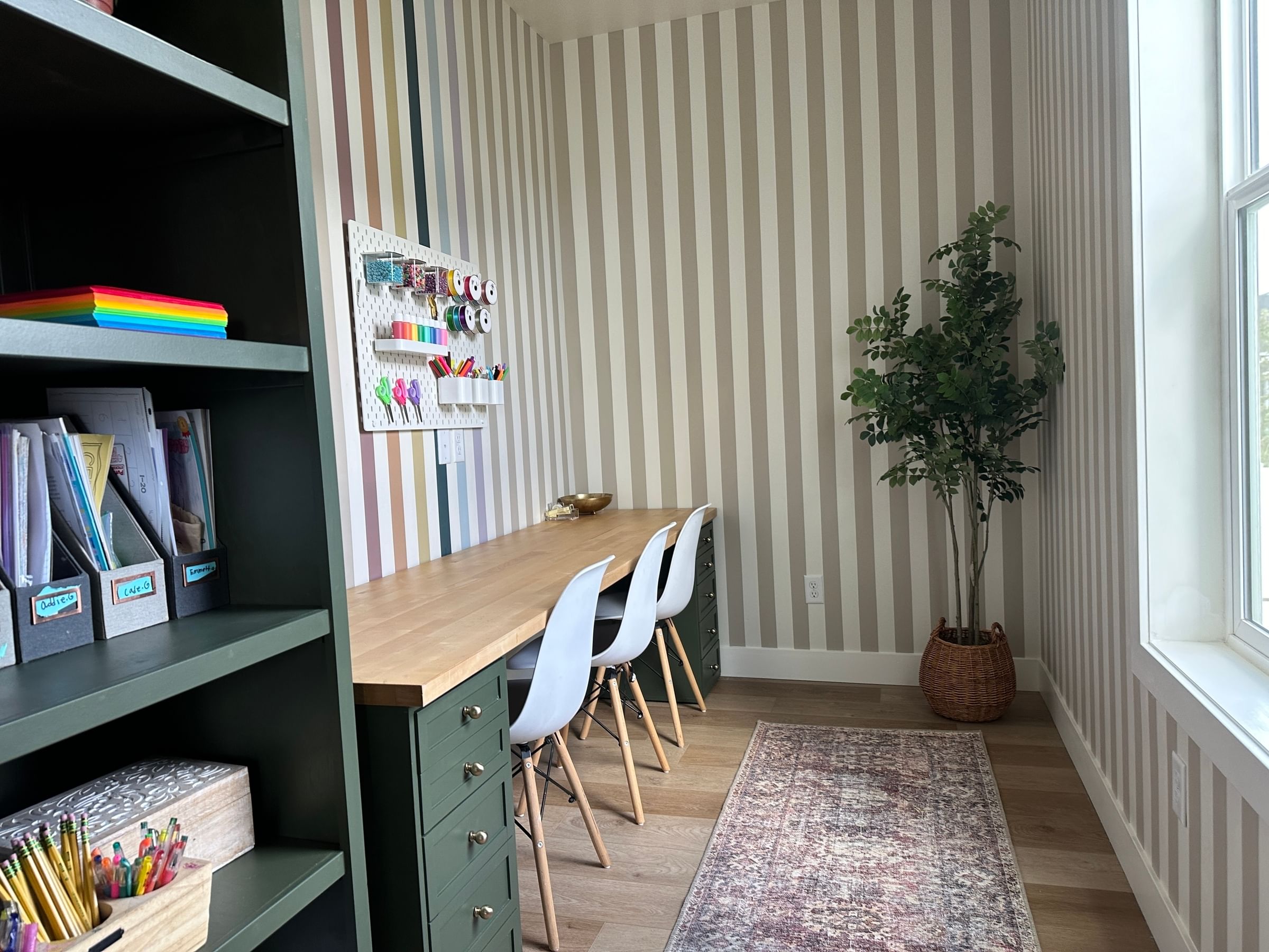 Modern Striped Craft Room with Book shelf and crafting table