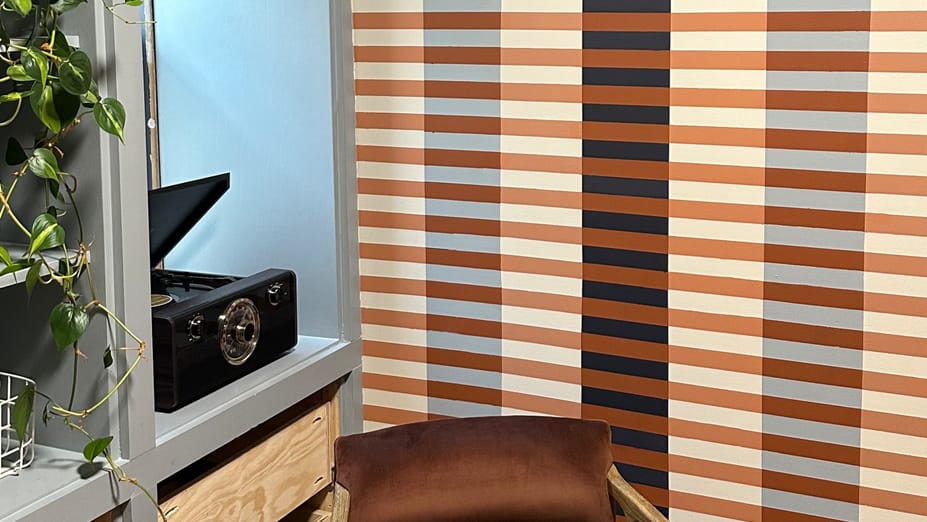 Trendy Room with Striped Line Mural on wall
