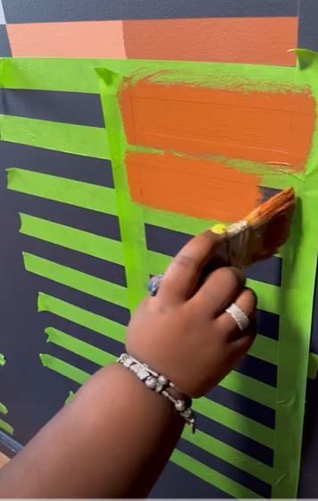 Kayla Nelson Painting a wall