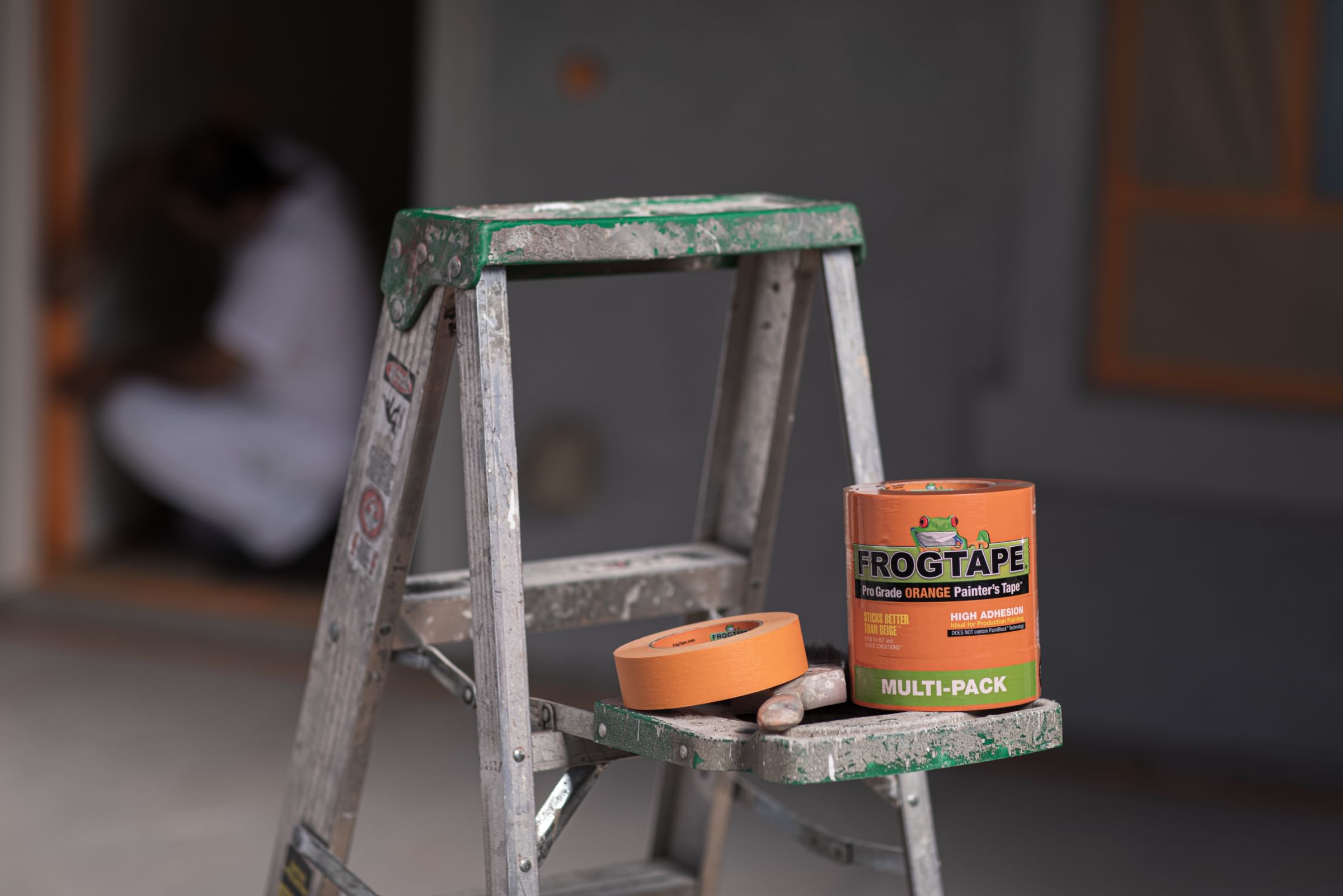 FrogTape Pro-Grade Orange Painter's Tape on a ladder