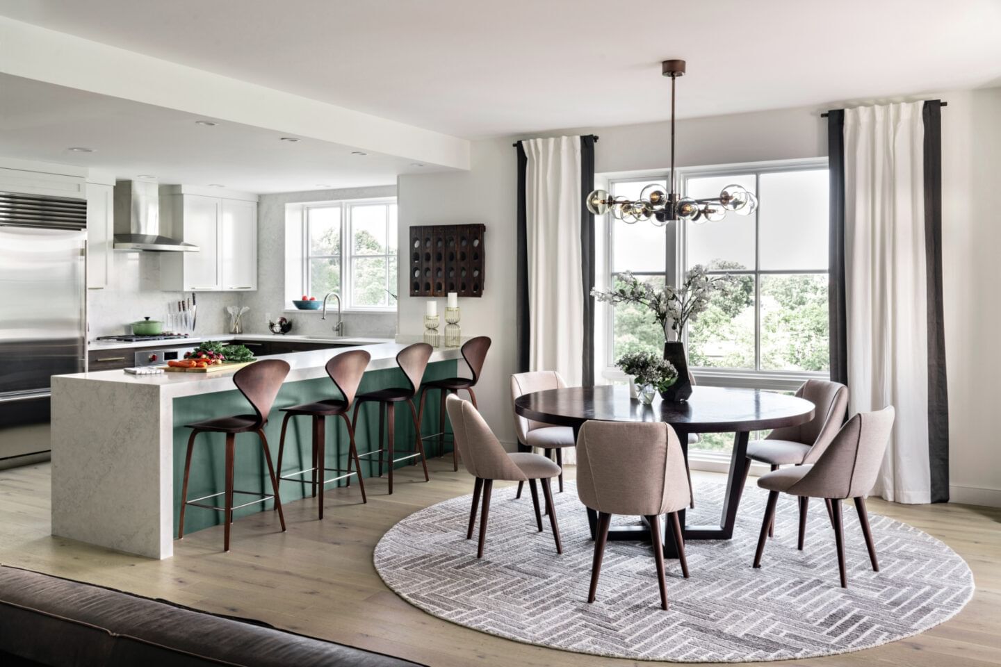 Contemporary kitchen with seaform green painted island