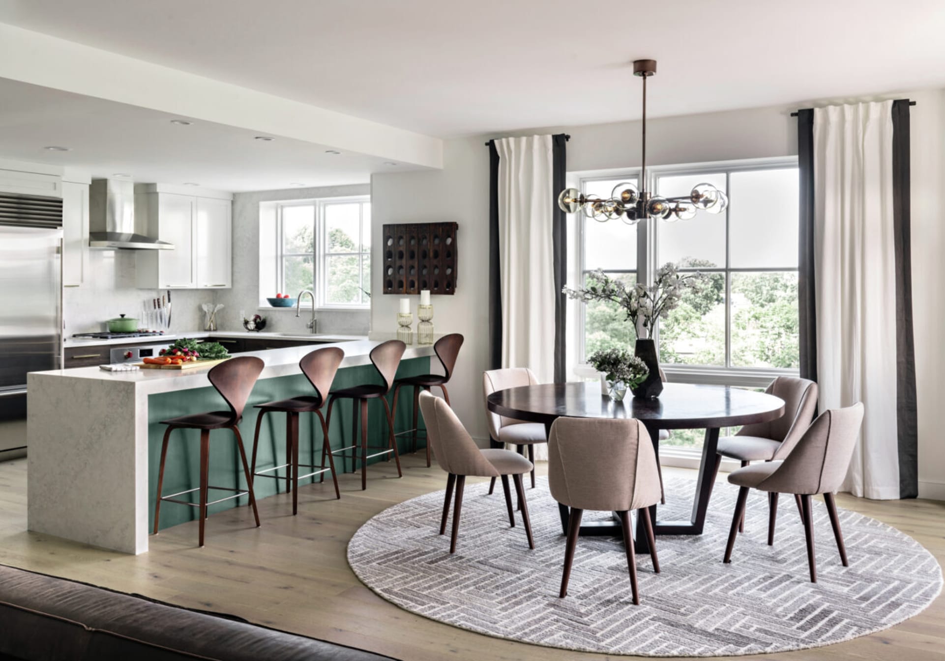 Contemporary kitchen with seaform green painted island