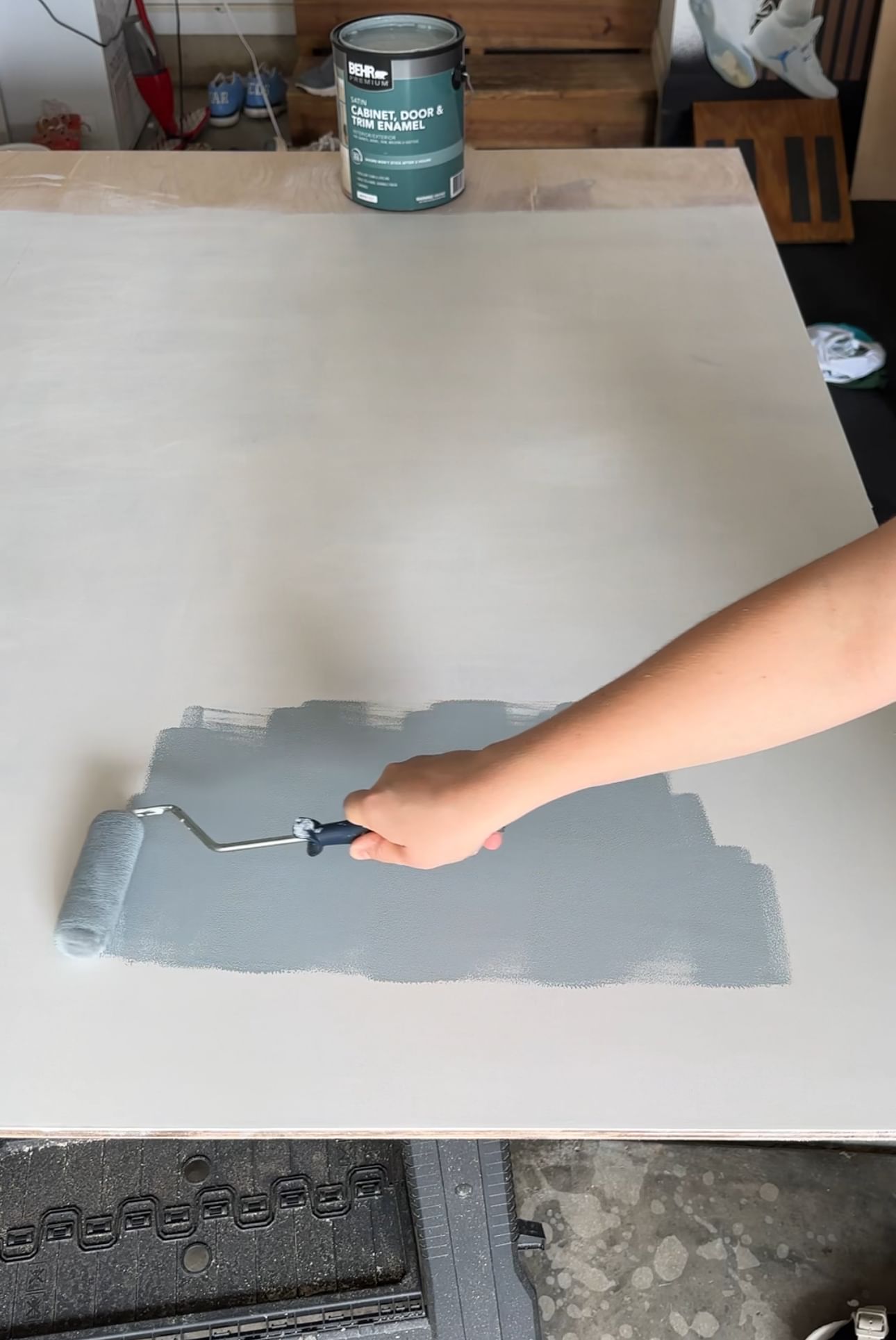 Painting with a roller on piece of drywall