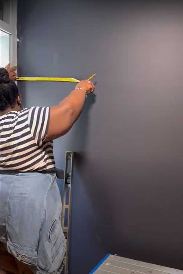 Kayla Nelson Measuring a wall